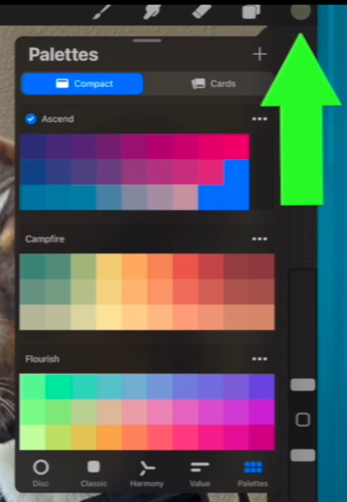 Against the backdrop of a Procreate file, a large green arrow points to a gray circle. The circle has opened a menu titlied "Palettes". Various squares of colors show the options that can be selected in three palette menus: ascend, campfire, and flourish.